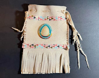 Native American-made buckskin pouch with fringe