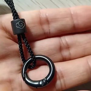 The Minimalist Eyeglass Holder, adjustable black cord eyeglass loop, The ultimate multi-tasking accessory, lanyard, key or glasses holder.