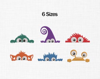 May include: Embroidered designs of six colorful, cartoonish monsters peeking over a surface. The monsters are in various colors, including green, purple, red, orange, blue, and yellow. The text "6 Sizes" is above the monsters.
