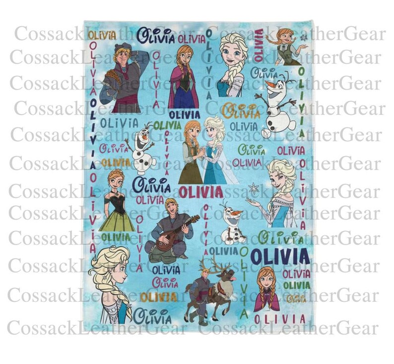 May include: A light blue blanket with illustrations of characters from the film "Frozen", and the name "Olivia" repeated across the design. The blanket features Elsa, Anna, Olaf, Kristoff, and other characters.