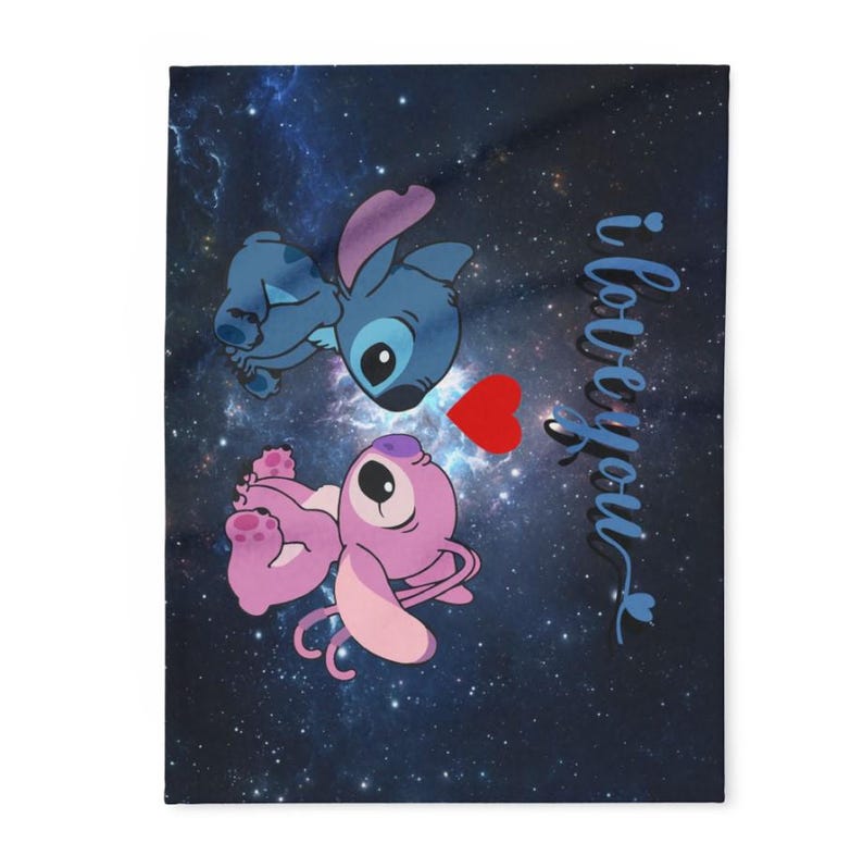 May include: A blanket featuring a blue and pink cartoon alien couple with a red heart on a dark blue background with a galaxy design. The words "i love you" are written in cursive.