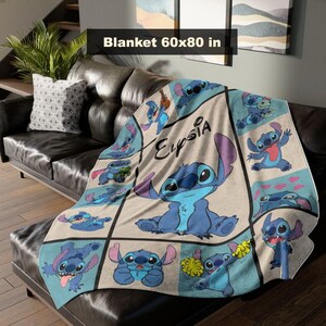 May include: A blue and beige blanket featuring the character Stitch from Lilo & Stitch. The blanket is 60 x 80 inches and has a grid pattern with various Stitch illustrations and the name "Elysia".