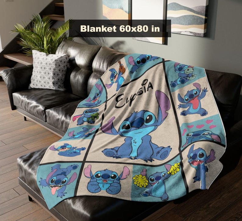 May include: A blue and beige blanket featuring the character Stitch from Lilo & Stitch. The blanket is 60 x 80 inches and has a grid pattern with various Stitch illustrations and the name "Elysia".