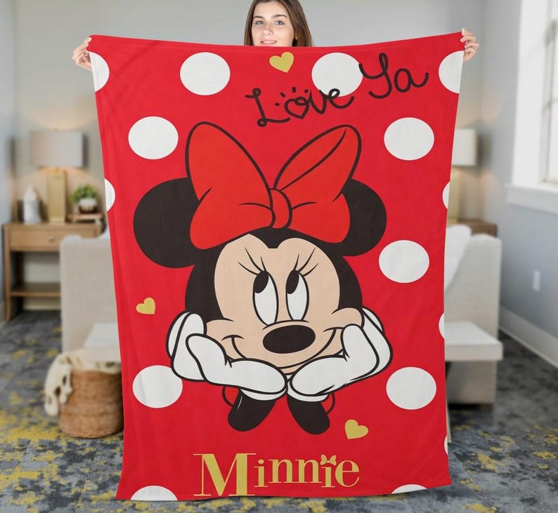 May include: Red blanket featuring Minnie Mouse with a large red bow, white polka dots, and the words "Love Ya" and "Minnie" in gold. The blanket has a cartoon design with gold heart accents.