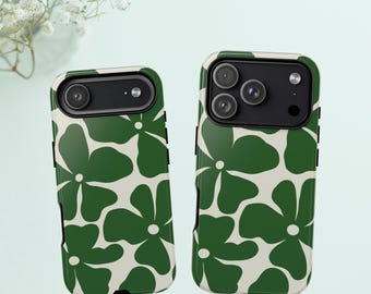 May include: Two mobile phone cases featuring a repeating pattern of large, dark green flowers on a cream-coloured background. The left case has a single camera lens cutout, while the right case features a triple camera lens array.