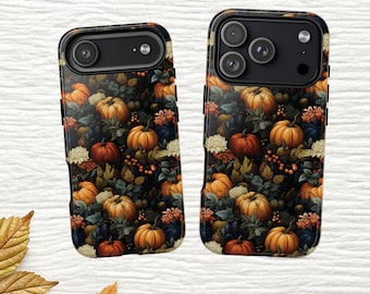 May include: Two smartphone cases featuring a dark, dense pattern of orange pumpkins, green foliage, and white flowers. The left case has a single camera cutout, while the right case features a triple camera array with a flash.