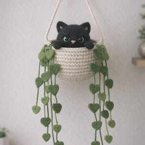 May include: A set of three ceramic mugs with a speckled, matte finish. The mugs are in shades of cream, light gray, and dark gray. Each mug has a simple, minimalist design, perfect for coffee or tea.