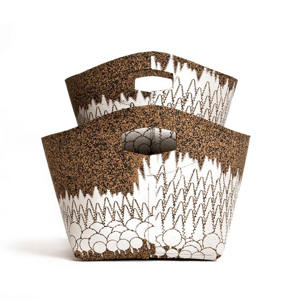 two baskets with white forest print, cork