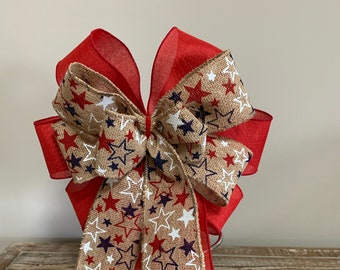 Patriotic wreath bow red white and blue Stars on a naturals burlap ribbon and solid red linen ribbon