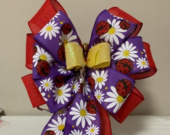Wreath Bow, decorative bow, gift bow, red linen ribbon, purple burlap with daisies and ladybugs and a yellow glitter ribbon center