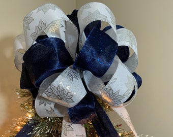 Large Christmas Tree topper white linen with silver shiny poinsettia flowers and a navy blue velour ribbon with shiny specks