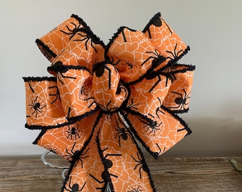 Halloween bow black an orange canvas ribbon printed with white spider webs and black black spiders
