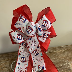 Patriotic wreath bow a red white and blue top hats and fireworks ribbon and solid red linen ribbon image 1