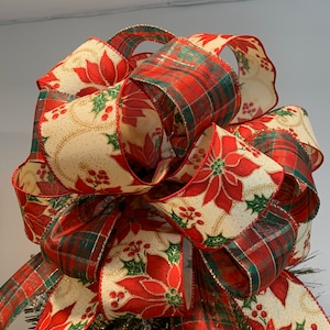 Large Christmas tree topper bow made with a red and green plaid ribbon and a Ivory ribbon with red poinsettia