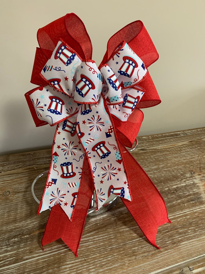 Patriotic wreath bow a red white and blue top hats and fireworks ribbon and solid red linen ribbon image 1