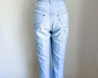 Vintage 1980s Orange Tab Levis Light Wash Jeans / 27" waist
