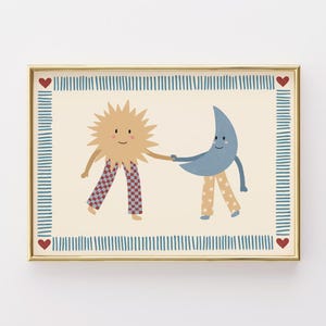 May include: A framed print featuring a smiling sun and moon holding hands. The sun wears checkered pants, and the moon wears star-patterned pants. The border has a blue striped design with red heart accents.