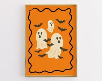 May include: A framed Halloween-themed print featuring three friendly ghosts and several black bats against an orange background. The artwork is enclosed in a gold frame with a black wavy border, perfect for seasonal decor.
