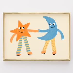 May include: A framed art print featuring a cartoon orange star and a blue crescent moon holding hands. The star wears blue and yellow striped pants, while the moon wears yellow pants with orange polka dots. Both figures have roller skates on.