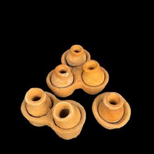 May include: A set of three ceramic mugs with a speckled, matte finish in cream, light grey, and dark grey. Each mug has a simple, minimalist design and a rounded handle.