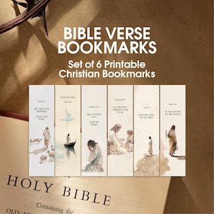 May include: Set of six printable Christian Bible verse bookmarks. Each bookmark features a watercolor illustration and a corresponding Bible verse. The bookmarks are displayed on top of an open Holy Bible.