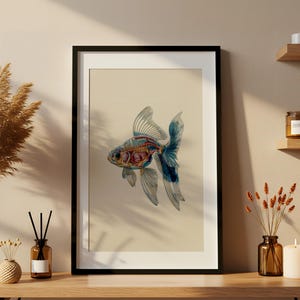 Veterinary anatomy illustration of a fish in a black frame, showing detailed internal organs, skeleton, and muscle structure. Displayed on a wooden shelf with candles and vases, the print combines vintage scientific art with cozy modern decor. This anatomy poster is perfect for veterinary clinics, aquariums, biology classrooms, or unique home interiors, blending education and art in one printable digital design.