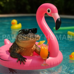 May include: A green alligator wearing sunglasses is floating in a pink flamingo pool float in a blue swimming pool. The alligator is holding a glass of orange juice with a green and yellow umbrella.