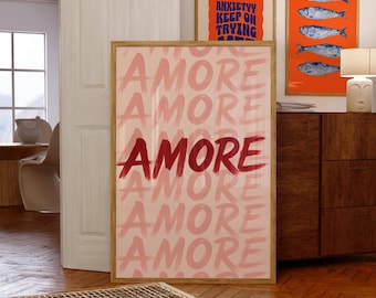 May include: A framed art print with the word "AMORE" in a repeating pattern of pink and red brushstrokes. Additional framed art pieces are visible in the background, including one with the text "ANXIETY KEEP ON TRYING".