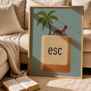 Escape key wall print in wooden frame styled on cozy beige sofa with natural sunlight and book – warm neutral home decor.