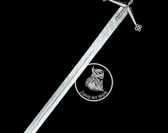 May include: A long, silver sword with a patterned blade and a decorative crossguard. The handle is black and intricately designed. The sword is set against a black background, with a circular logo that reads "Zahid Art Work".