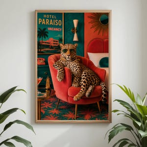 May include: A framed art print featuring a leopard wearing sunglasses, lounging in a red armchair. The artwork has a retro hotel theme, with a sign that reads "Hotel Paraiso Vacancy". The background includes a cocktail and a vintage phone.