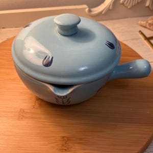 Mid-Century Cronin blue tulip casserole dish with lid.
