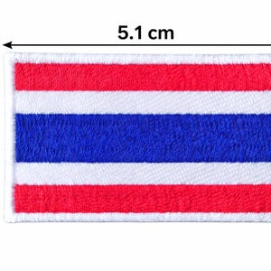 May include: Embroidered patch of the Thai flag, measuring 5.1 cm by 3.3 cm. The design features horizontal stripes of red, white, and blue. The patch has a white border. A rectangular patch.