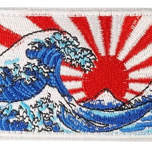May include: Embroidered patch featuring a blue wave with white foam and a red rising sun with white rays. The wave is in the foreground and the sun is in the background.