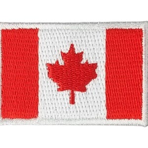 May include: A red and white embroidered patch featuring the Canadian flag. The flag has a red maple leaf on a white background with red stripes on either side.