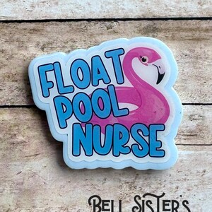 May include: A light blue and white sticker with the words "FLOAT POOL NURSE" in blue block letters. A pink flamingo is featured in the design. The sticker has a light blue border and the Bell Sister's Designs OK logo.