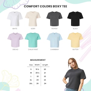 May include: A product image showcasing a Comfort Colors Boxy Tee in various colors: white, ivory, pepper, black, orchid, chalky mint, chambray, and butter. The image includes a measurement chart with sizes and dimensions in inches.