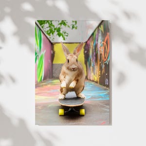 May include: A brown rabbit with white fur on its chest and belly is standing on a black skateboard with yellow wheels. The rabbit is in a colorful alleyway with graffiti on the walls.