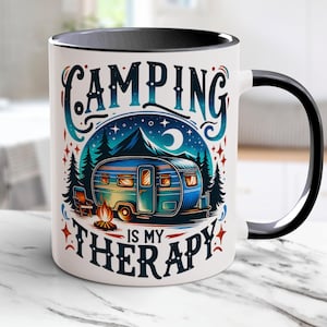 A retro-style "Camping Is My Therapy" PNG mug wrap design featuring a cozy camper under a starry sky, surrounded by pine trees, a campfire, and a chair. Perfect for sublimation on mugs, t-shirts and DIY projects.