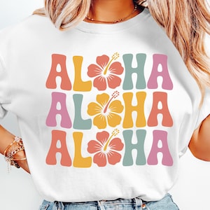 Bring the tropical paradise to your products with this stunning Aloha hibiscus design! Perfect for creating eye-catching summer apparel, vacation merchandise, and beach-themed items that sell. The vibrant retro typography and colorful hibiscus flowers instantly evoke that laid-back island vibe customers crave.