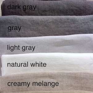 May include: Six fabric swatches in various shades of gray, white, and beige. The swatches are labeled "dark gray", "gray", "light gray", "natural white", "creamy melange", and "natural".