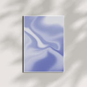 May include: A framed abstract art print featuring a swirling design in shades of periwinkle and white. The artwork has a smooth, flowing appearance, with soft transitions between colors. The print is displayed on a white wall with shadows.