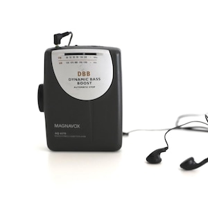 vintage 80s sony style WALKMAN tape deck player -- battery operated, includes AM/FM radio option -- comes with headphones