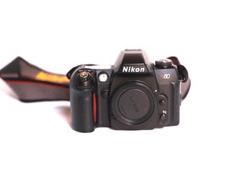 vintage NIKON y2k 35 MM film camera BODY with original Nikon strap-- tested and working