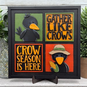 May include: A square black frame containing four panels. The top left shows a black crow on a green background. The top right features the black text GATHER LIKE CROWS on an orange background. The bottom left displays orange text CROW SEASON IS HERE on a black background. The bottom right shows a crow wearing a tan hat and holding a corn cob on an orange background.