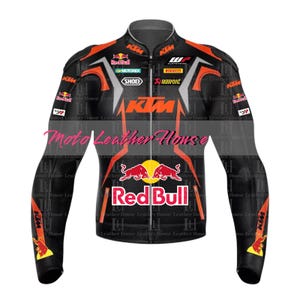 May include: Black leather motorcycle jacket with orange and white accents. The jacket features the logos of Red Bull, KTM, and Akrapovic.