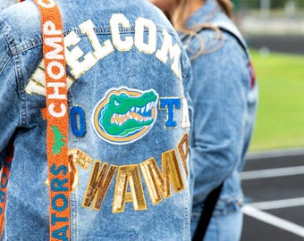 Gators oranje en blauwe band met kralen en doorzichtige tas