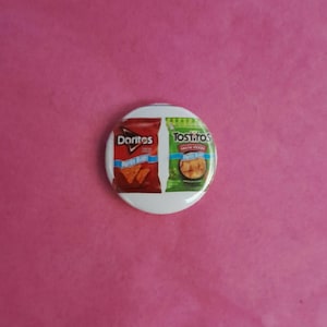 May include: A white badge displaying images of Doritos and Tostitos crisps. The Doritos packet is red, showing the brand name and a picture of the crisps. The Tostitos packet is green, with the brand name and a picture of the crisps.