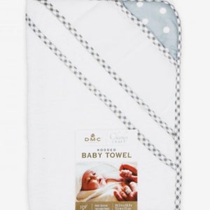 May include: White hooded baby towel with a gray and white checkered trim. The towel has a blue and white polka dot hood. The label reads "DMC Classic Craft Hooded Baby Towel".