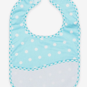 May include: A light blue baby bib with white polka dots and a turquoise checkered trim. The bib has a white, embroidered pocket.